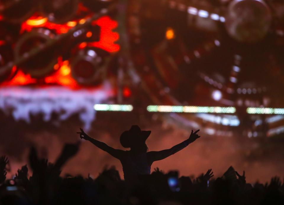 Festivalgoers cheer for Morgan Wallen as he performs his headlining set on the Mane Stage during Stagecoach country music festival in Indio, Calif., Sunday, April 28, 2024.