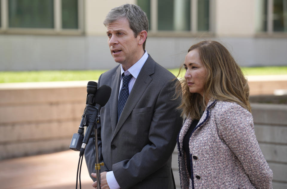 David Oscar Markus, left, and his co-counsel, Margot Moss, speak after a judge handed down a sentence of life in prison and more than $15 million in penalties to their client, Larry Rudolph, the wealthy owner of a Pittsburgh-area dental franchise, for killing his wife at the end of an African safari in Zambia, during a sentencing hearing Monday, Aug. 21, 2023, in the federal courthouse in Denver. (AP Photo/David Zalubowski)