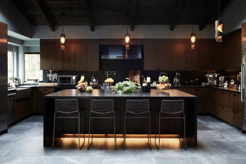 Architect April Gray of Lamb & Gray Architects helped actor Wilmer Valderrama with the kitchen floor planning in his L.A. home, which included replacing the windows with more panoramic glass that would let in not only more light, but green. Materiality was important to Valderrama, who chose light blue Roman clay for the walls and dark granite that felt rustic, yet elegant and sharp, and could withstand actual cooking. For the cabinetry, the veins of the wood line up top to bottom. “They were all cut from the same plank, so it’s symmetrical. When you walk in, nothing is distracting, it all becomes part of the same DNA.”