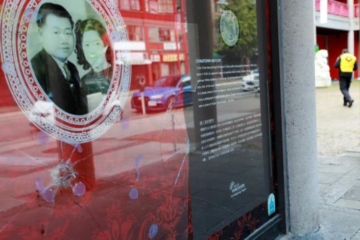 A broken window at Vancouver's Chinese Cultural Centre, pictured in May, 2020 is just one of the acts of vandalism and racist taunts that have targeted Chinese-Canadians since the start of the coronavirus pandemic (AFP Photo/David P. BALL)