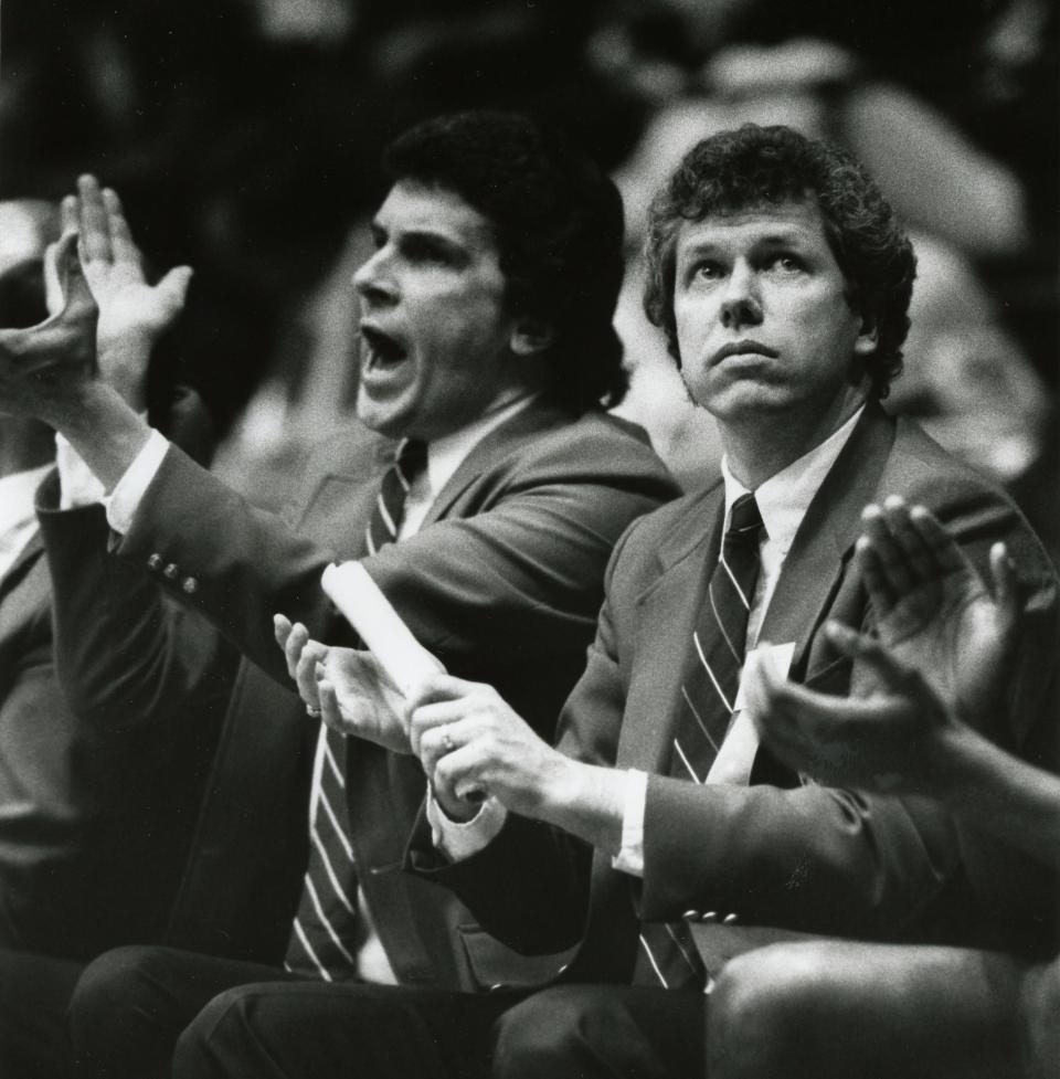 Former Central-Hower basketball coach Mike Meneer looks up at the game clock during the Class AAA state championship.