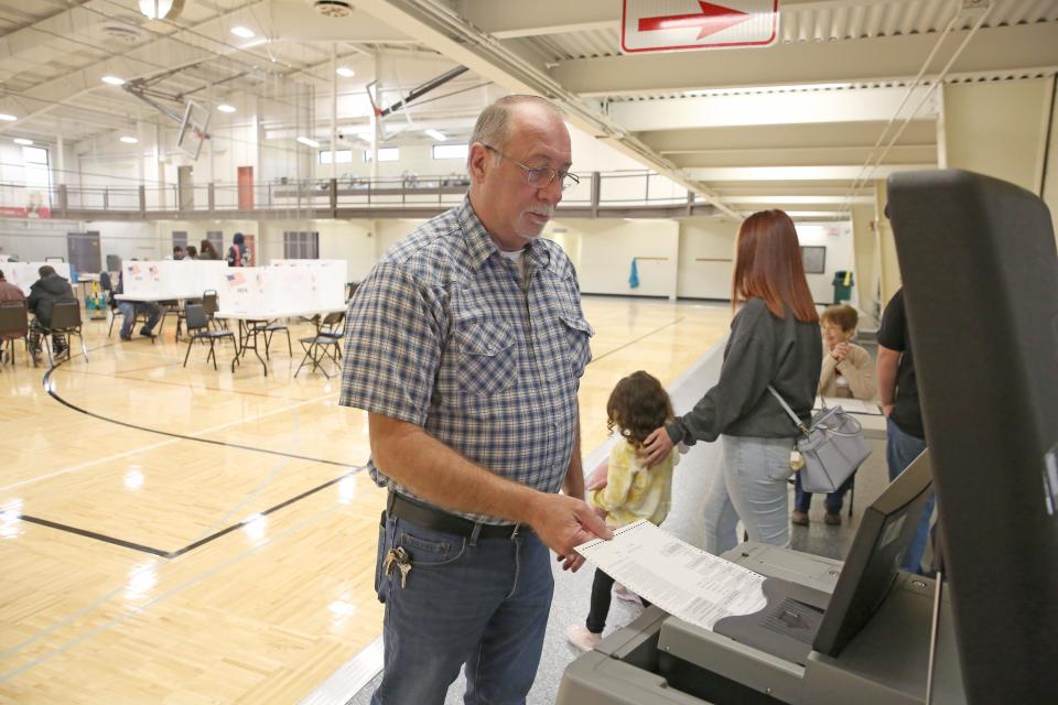 Harry Ewing, 60, of Fremont, casts his ballot at the Fremont Recreation Center, where four precincts from Fremont's east side vote. According to Site Administrator Ken Cleary, turnout was very good Tuesday morning.