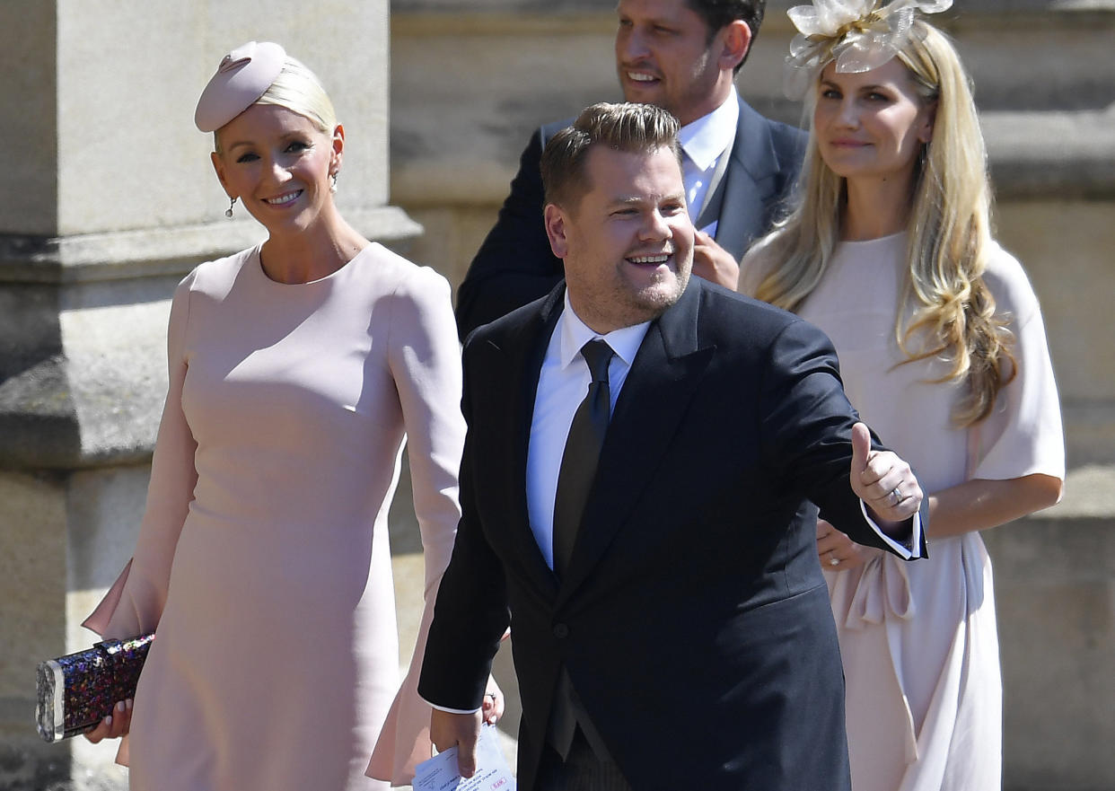 Actor and TV host James Corden and his wife, Julia Carey, arrive at the royal wedding on May 19. (Photo: TOBY MELVILLE via Getty Images)