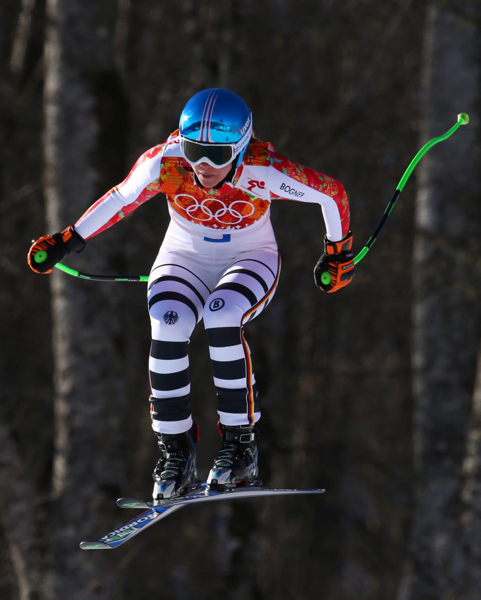 Germany's Viktoria Rebensburg makes a jump in the women's downhill at the Sochi 2014 Winter Olympics, Wednesday, Feb. 12, 2014, in Krasnaya Polyana, Russia. (AP Photo/Alessandro Trovati)