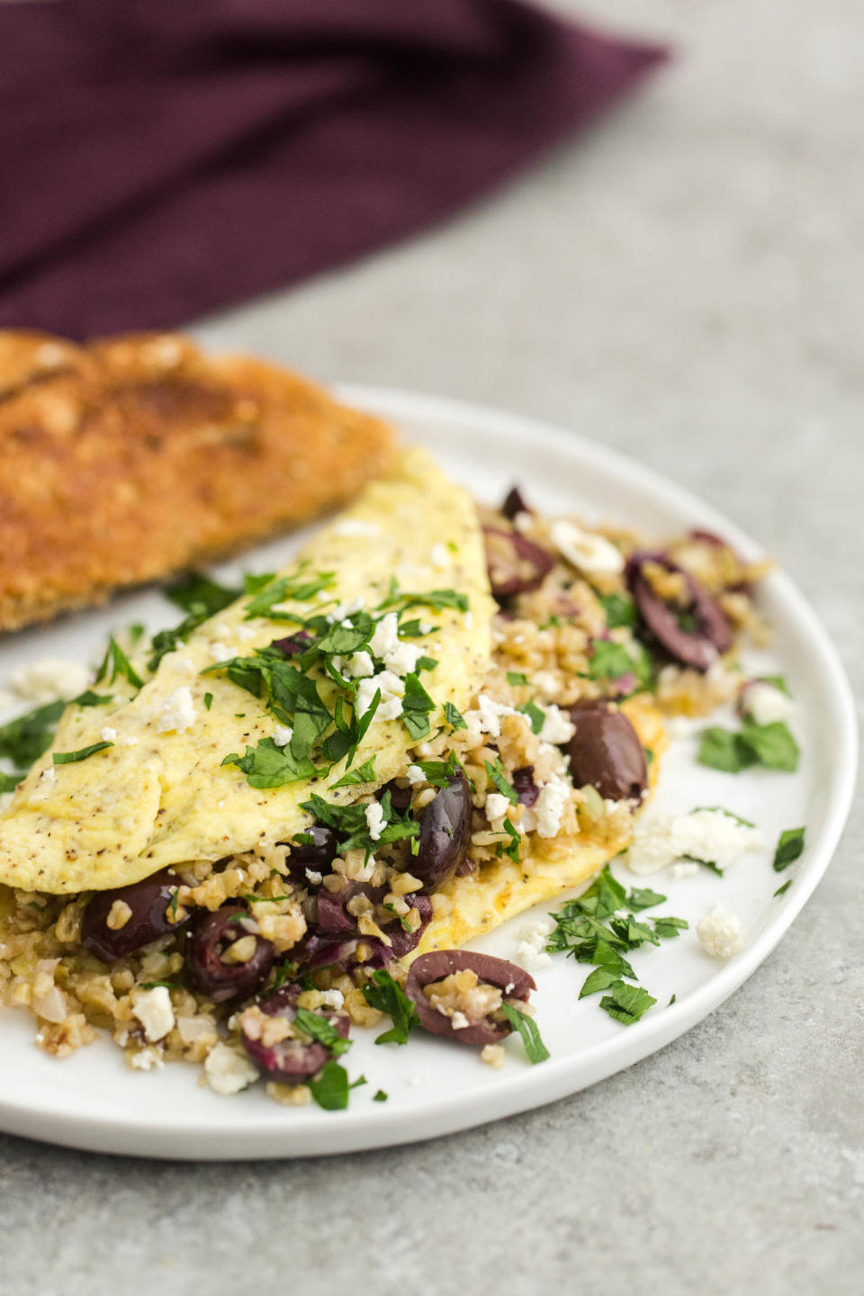 <strong>Get the <a href="http://naturallyella.com/freekeh-omelette-with-olives/" target="_blank">Freekeh Omelet with Olives and Feta recipe</a>&nbsp;from Naturally Ella</strong>