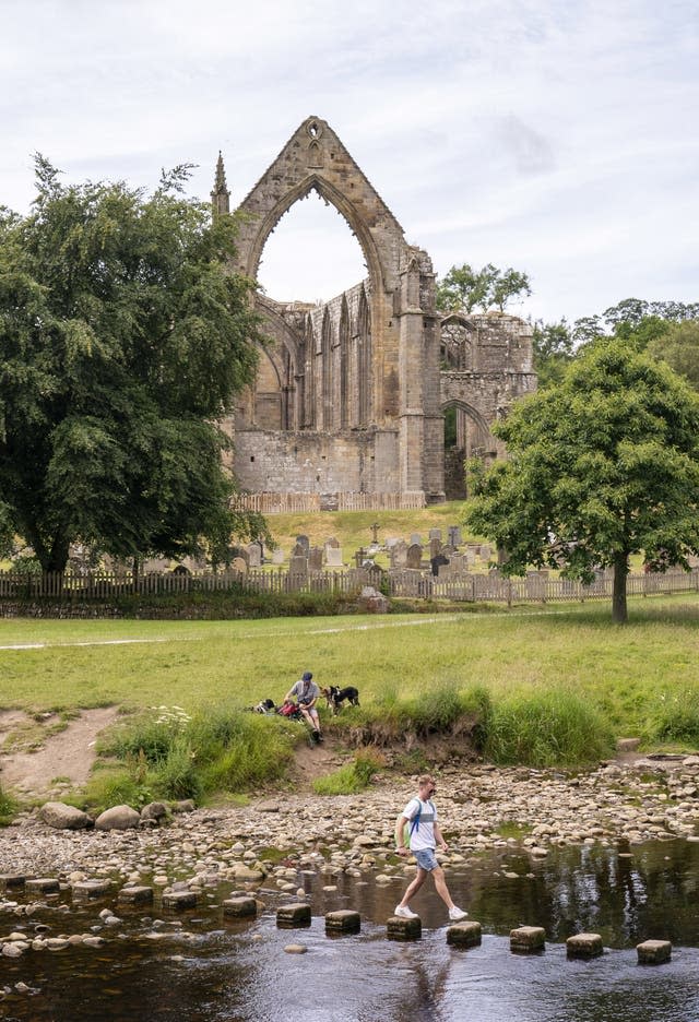 People enjoy the hot weather at Bolton Abbey in North Yorkshire