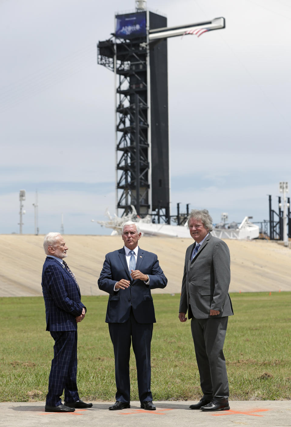 Apollo astronaut Buzz Aldrin, left, talks with Vice President Mike Pence, center, and Rick Armstrong, son of Apollo 11 astronaut Neil Armstrong as they gather at pad 39a the Kennedy Space Center where the launch of Apollo 11 took place 50 years ago on this anniversary of the moon landing, Saturday, July 20, 2019, in Cape Canaveral, Fla. (AP Photo/John Raoux)