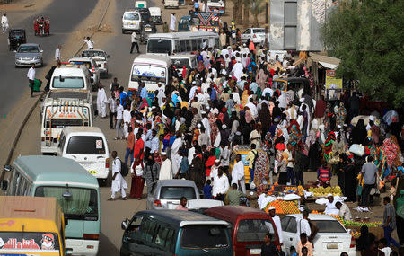 Sudanese residents wait for buses on a street in Khartoum, Sudan, May 4, 2019. REUTERS/Umit Bektas