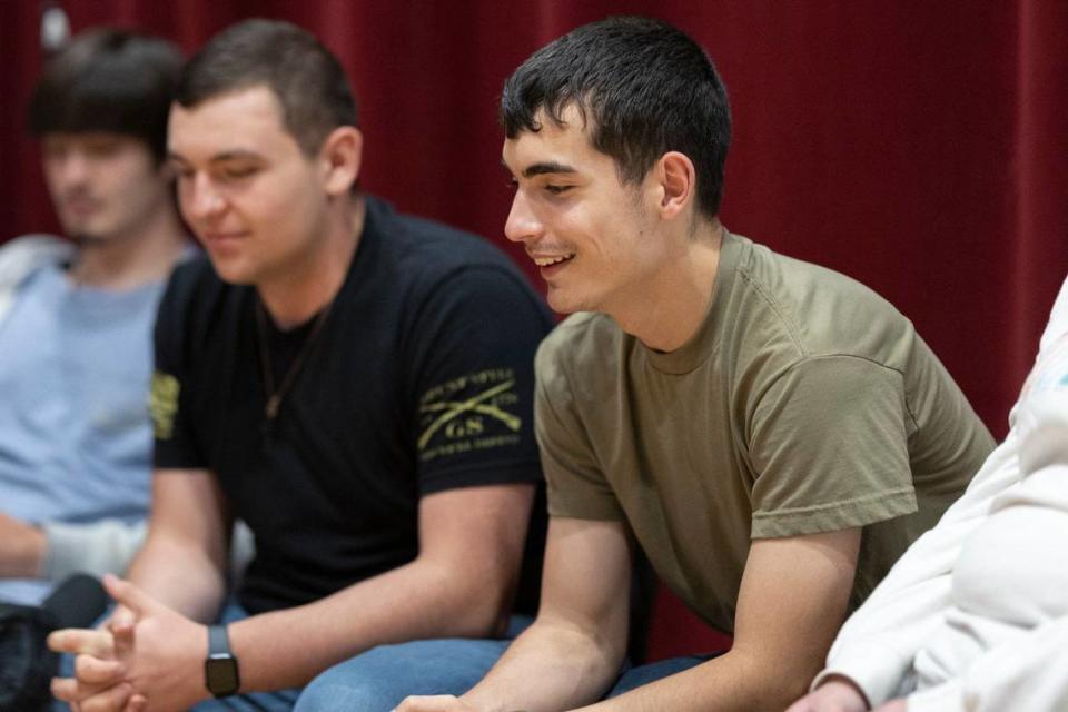 Recent Harlan County High School graduate Mason Combs, right, is photographed at the school in Harlan, Ky., on Wednesday, May 8, 2024.