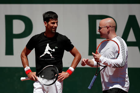 Tennis - French Open - Roland Garros - Paris - 25/05/2017. Novak Djokovic of Serbia and his coach Andre Agassi during a training session. REUTERS/Benoit Tessier