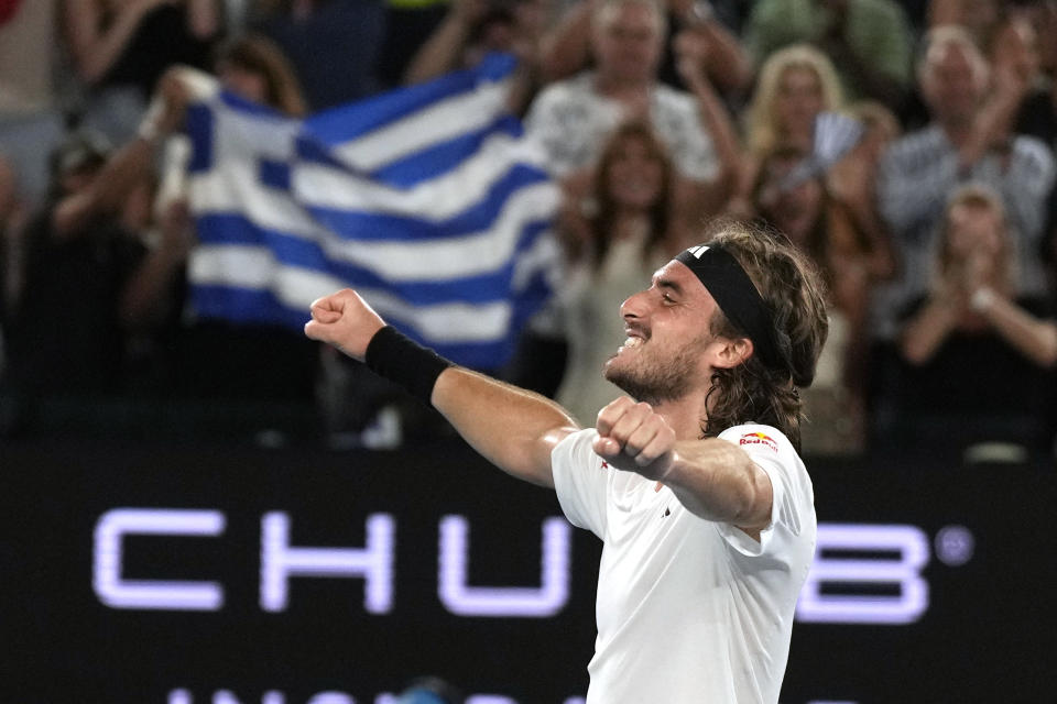 Stefanos Tsitsipas of Greece celebrates after defeating Jannik Sinner of Italy during their fourth round match at the Australian Open tennis championship in Melbourne, Australia, Sunday, Jan. 22, 2023. (AP Photo/Ng Han Guan)