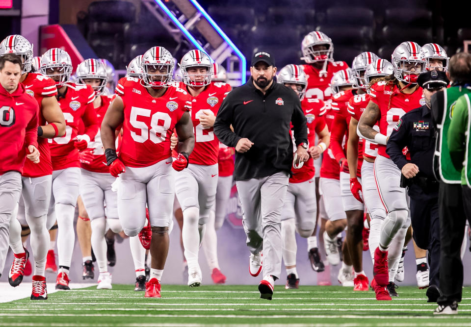 ARLINGTON, TX - DECEMBER 29: Ohio State head coach Ryan Day leads his team onto the field during the 88th annual Cotton Bowl game between the Missouri Tigers and the Ohio State Buckeyes on Friday, December 29, 2023 at AT&T Stadium in Arlington, TX.  (Photo by Nick Tre. Smith/Icon Sportswire via Getty Images)