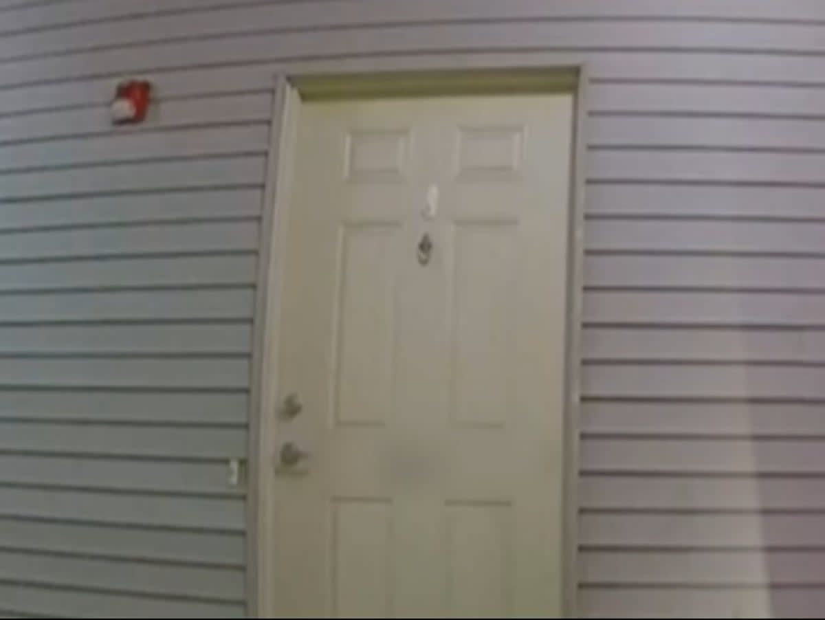 An image of a door in the neighborhood where Sayreville City Councilwoman Eunice Dwumfour was shot and killed. The video captures the sound of the gunshots the night of her death (Screengrab/ 12 News New Jersey)