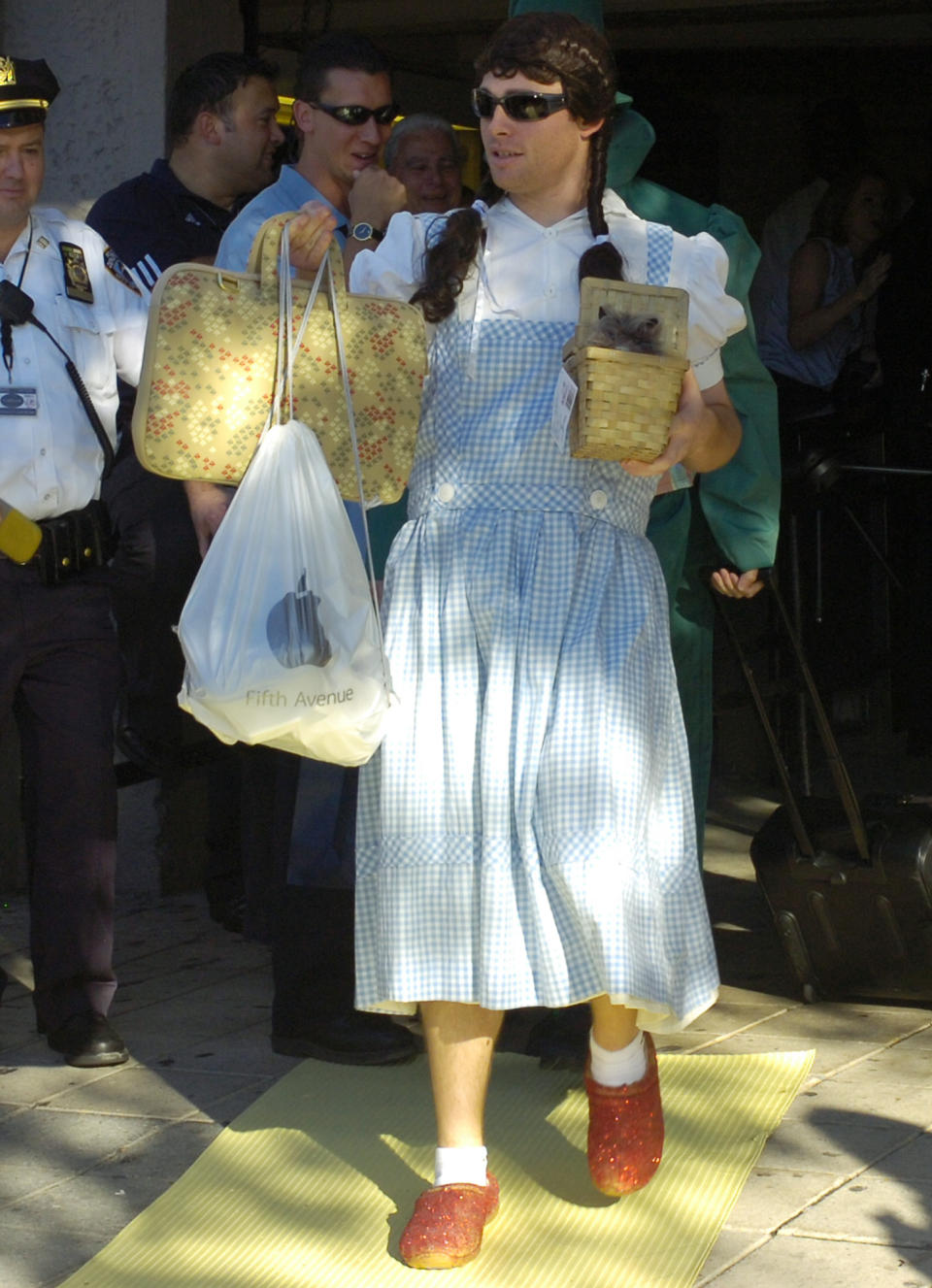 FILE - In this Sept. 24, 2007, file photo, New York Yankees' Ian Kennedy is dressed as Dorothy from "The Wizard of Oz" as he leaves the stadium after a baseball game against the Toronto Blue Jays, at Yankee Stadium in New York. That baseball hazing ritual of dressing up rookies as Wonder Woman, Hooters Girls and Dallas Cowboys cheerleaders is now banned. Major League Baseball created an Anti-Hazing and Anti-Bullying Policy that covers the practice. As part of the sport's new labor deal, set to be ratified by both sides Tuesday, Dec. 13, 2016, the players' union agreed not to contest it. AP Photo/Bill Kostroun, File)