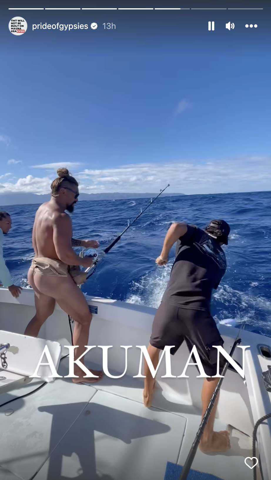 Jason Momoa wears a beige thong while holding fast to his fishing line during a recent trip on the boat. (Instagram/prideofgypsies)