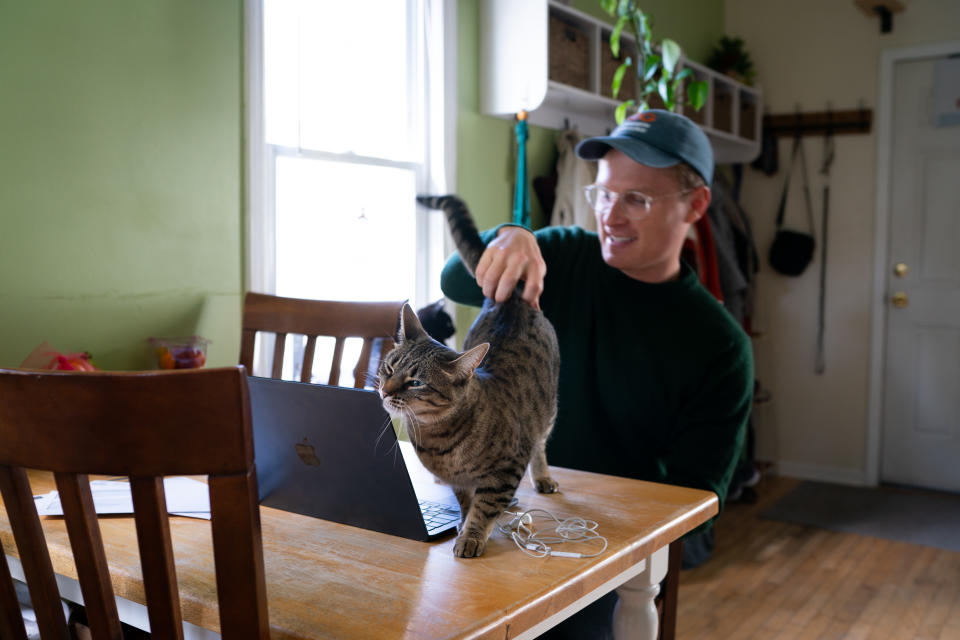 Kevin at work at his kitchen table. (Sarah L. Voisin/The Washington Post)