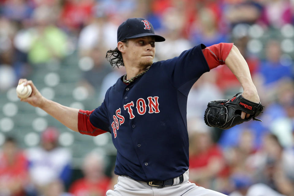 Boston Red Sox starting pitcher Clay Buchholz works against the Texas Rangers in the first inning of a baseball game, Friday, May 9, 2014, in Arlington, Texas. (AP Photo/Tony Gutierrez)