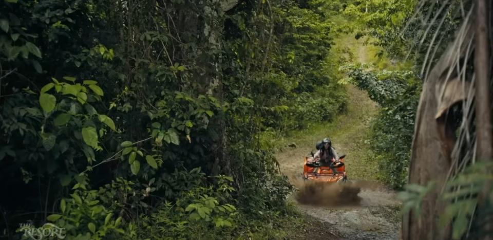 Cristin Milioti rides an ATV through the jungle in "The Resort"