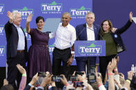 Former President Barack Obama, center, smiles at the crowd along with Democratic gubernatorial candidate, former Virginia Gov. Terry McAuliffe, second from right, his wife, Dorothy McAulffe, right, attorney general candidate Mark Herring, left, and lieutenant governor candidate Hala Ayala, second from left, during a rally in Richmond, Va., Saturday, Oct. 23, 2021. McAuliffe will face Republican Glenn Youngkin in the November election. (AP Photo/Steve Helber)