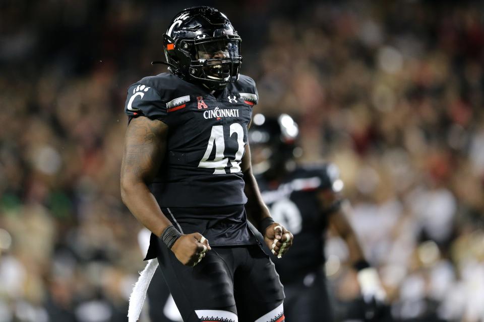 Cincinnati Bearcats defensive end Malik Vann (42) celebrates a sack in the fourth quarter of a college football game against the UCF Knights, Friday, Oct. 4, 2019. UC sacked Dillon Gabriel three times that night. Now Gabriel is back with his new team, the Oklahoma Sooners.