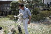 Akita breeder Osamu Yamaguchi Yamaguchi says he travels overseas about 20 times a year to personally deliver Akitas to their new owners