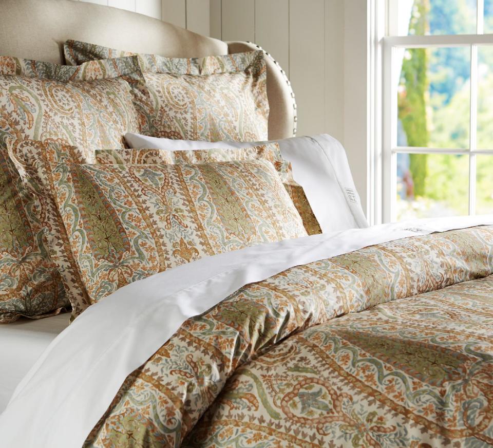 This publicity photo provided by Pottery Barn shows an Agatha bedding set that comes in a blue or red colorway. Paisleys and other rich patterns are popular in textiles for Fall 2013. (AP Photo/Pottery Barn)
