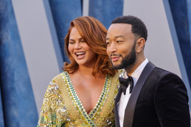 Chrissy Teigen Mixes Sheer & Feathers at Vanity Fair Oscar Party 2023 in  5-Inch Heels With John Legend