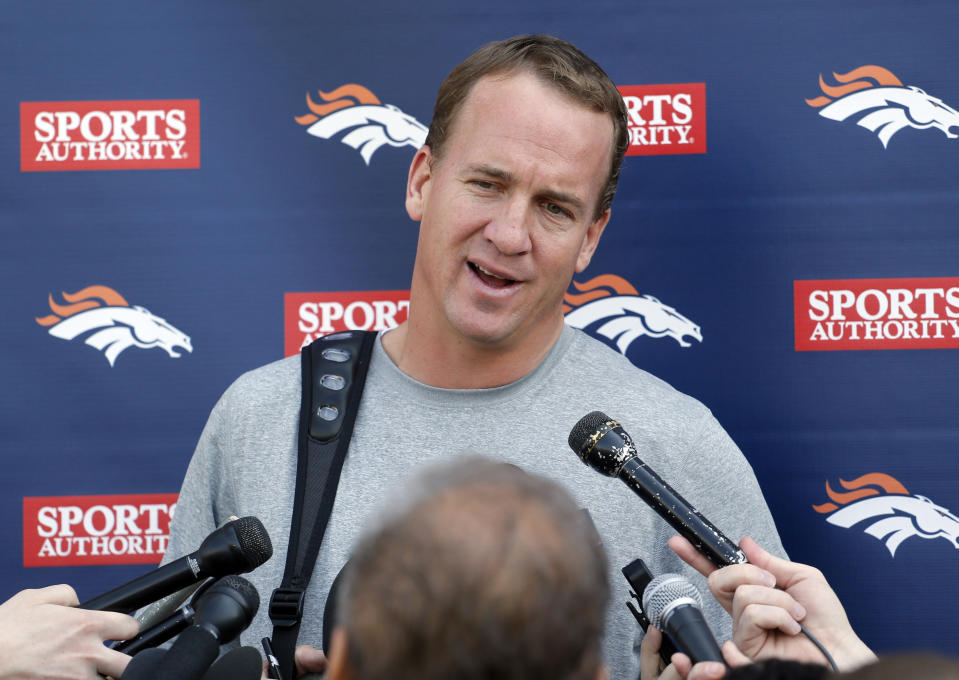 Denver Broncos quarterback Peyton Manning talks to the media after working out at the NFL football teams training facility in Englewood, Colo., on Monday, April 21, 2014. (AP Photo/Ed Andrieski)