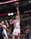 Chicago Bulls' Goran Dragic shoots during the first half of an NBA basketball game against the Washington Wizards Wednesday, Dec. 7, 2022, in Chicago. (AP Photo/Charles Rex Arbogast)