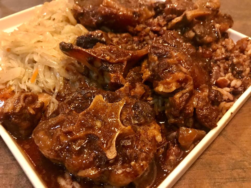The sizable, tender oxtails entree at Pepperpot Jamaican Cuisine in Bronzeville, with cabbage and rice and peas.