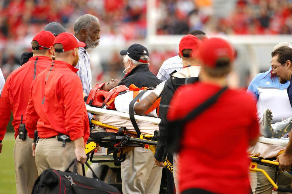 Devon Gales, shown as he is carted off the field on Sept. 26, 2015, is making progress after becoming paralyzed from the waist down that day.&nbsp; (Photo: Todd Kirkland via Getty Images)