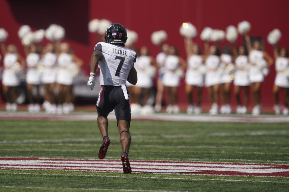 Cincinnati's Tre Tucker (7) runs back a kickoff 99-yards for a touchdown during the second half of an NCAA college football game against Indiana, Saturday, Sept. 18, 2021, in Bloomington, Ind. Cincinnati won 38-24. (AP Photo/Darron Cummings)