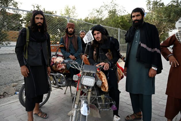 Taliban fighters stand along a road in Kabul on August 18, 2021, after the Taliban's military takeover of Afghanistan. (Photo: WAKIL KOHSAR via Getty Images)
