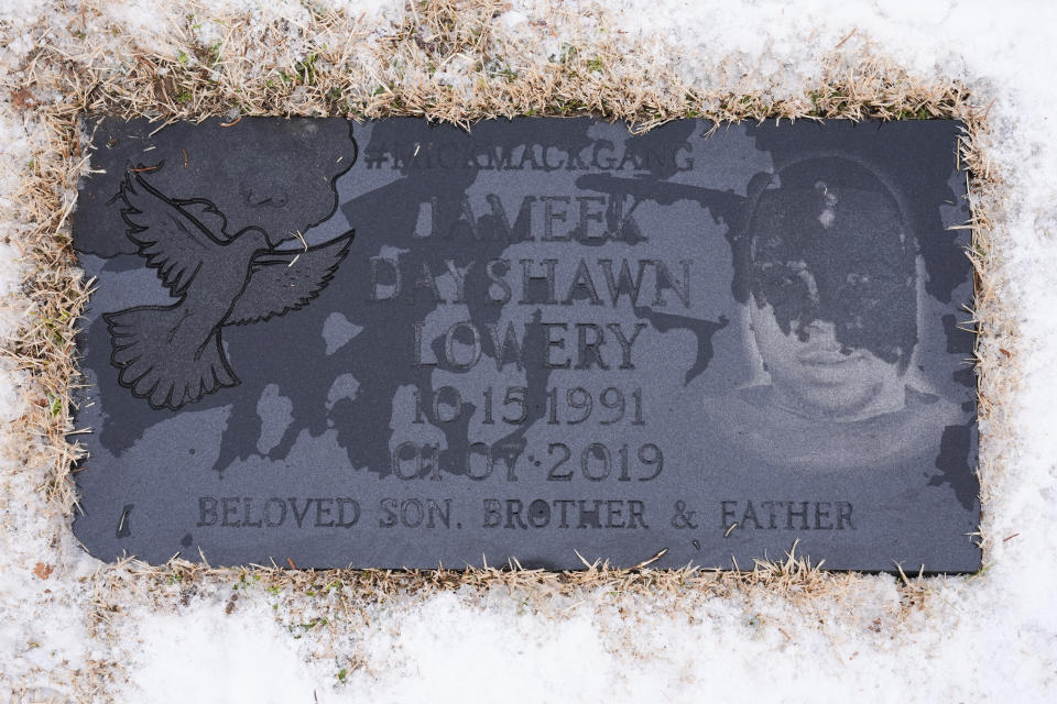 The tombstone of Jameek Lowery is seen as friends and family visit in Garfield, N.J., Thursday, Jan. 18, 2024. Shaquana Duncan, the mother of one of Lowery’s children, filed a federal lawsuit that alleged police had used excessive force on Lowery, who was “unarmed and posed no danger.” (AP Photo/Seth Wenig)