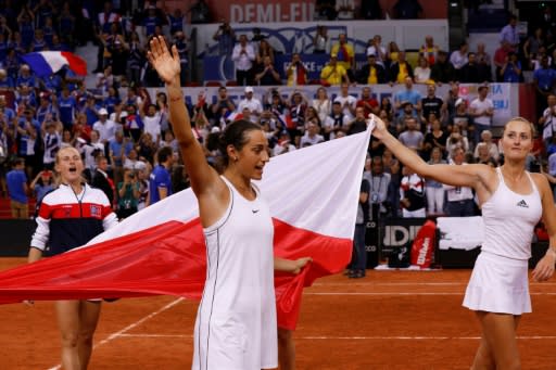 Team leaders: France's Kristina Mladenovic (right) and Caroline Garcia celebrate their Fed Cup semi-final win over Romania that put them into the final against Australia