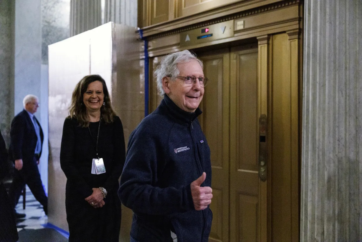 Senate Minority Leader Mitch McConnell (R-Ky.) gives a thumbs up as the Senate votes to pass a long-awaited foreign aid package for Ukraine and Israel early Tuesday morning, Feb. 13, 2024. (Anna Rose Layden/The New York Times)