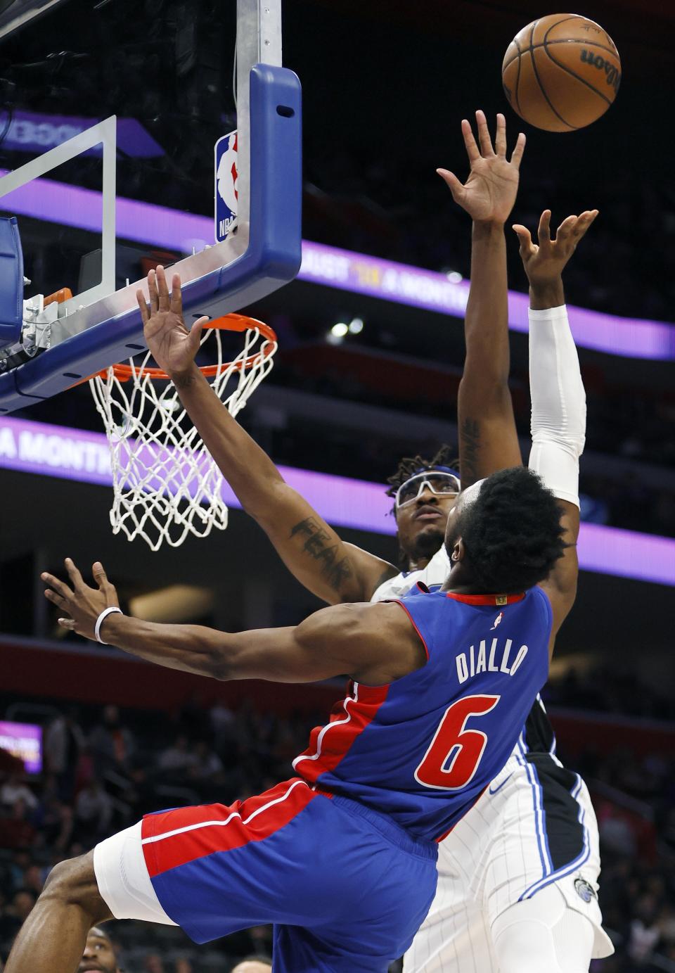 Orlando Magic center Wendell Carter Jr. (34) blocks a shot attempt by Detroit Pistons guard Hamidou Diallo (6) during the first half of an NBA basketball game Wednesday, Dec. 28, 2022, in Detroit. (AP Photo/Duane Burleson)