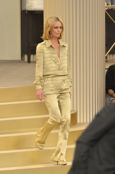 Vanessa Paradis in a silk collared shirt and matching flared pants at the Chanel show.