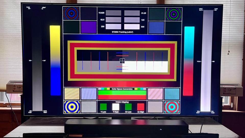 A Samsung TV showing a test pattern on screen