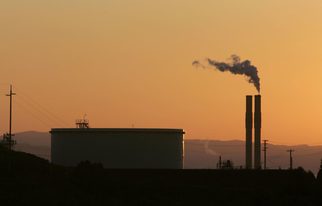 In this file photo, an oil refinery is seen at sunset in Rodeo, Calif. 