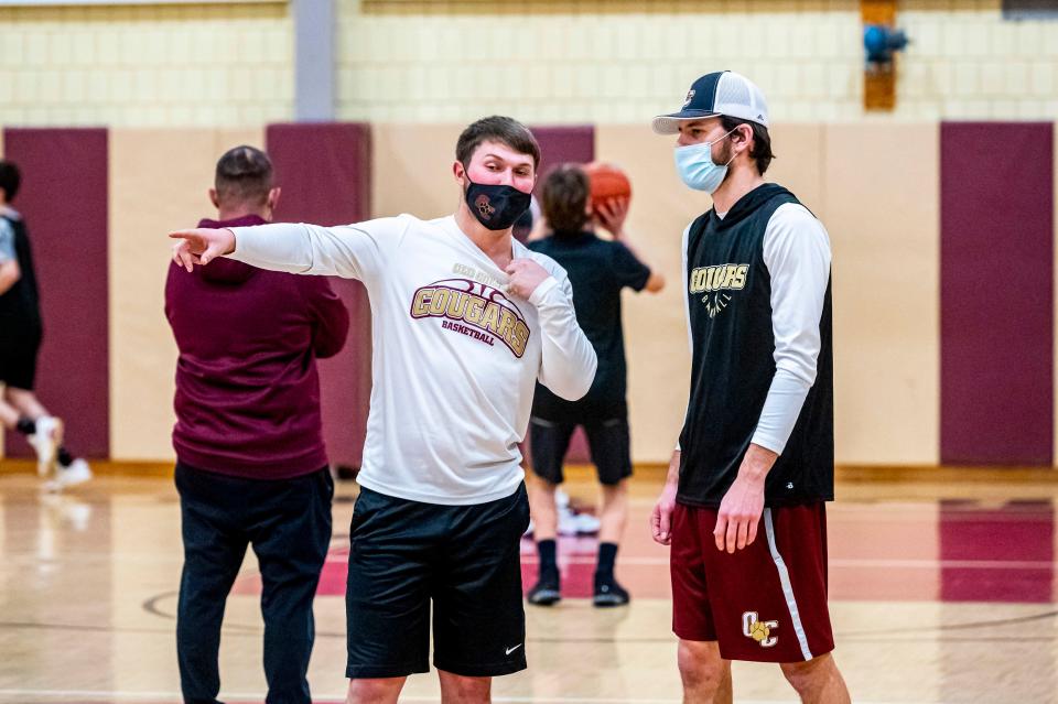 Old Colony assistant coach Paul Soucy and Jake Jason working together at practice.