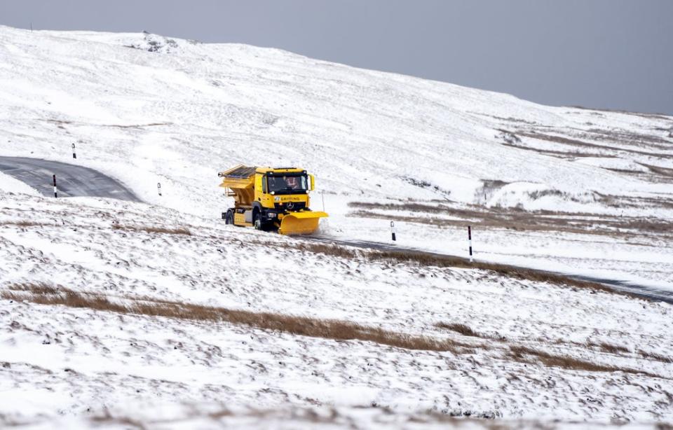 A snow plough on the Buttertubs Pass near Hawes, North Yorkshire (Danny Lawson/PA) (PA Wire)