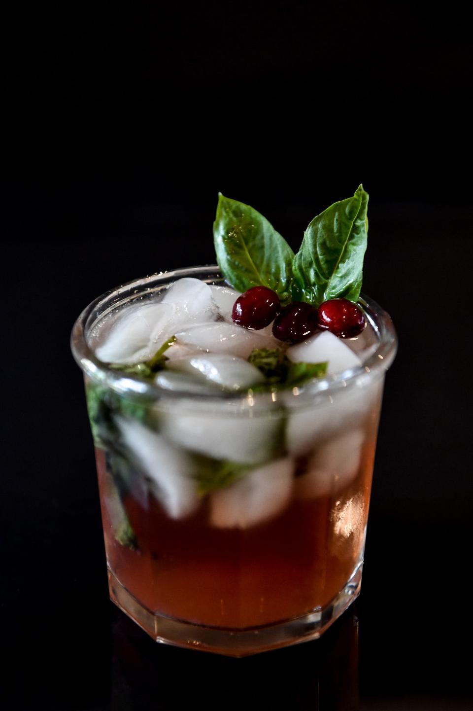 The 'Pomegranate Pines' cocktail is made with Mississippi-owned Wonderbird gin and has a fragrant edge from freshly muddled basil.