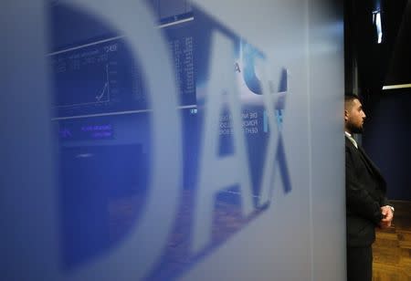 FILE PHOTO: The DAX (German stock index) logo is seen at the stock exchange in Frankfurt, Germany, March 23, 2018. REUTERS/Kai Pfaffenbach