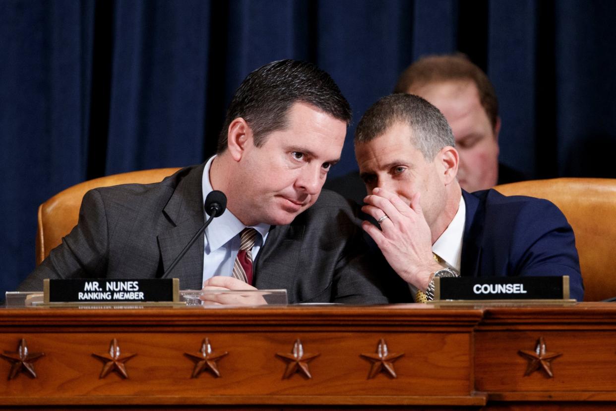 Devin Nunes, ranking Republican minority member on the House Intelligence Committee, confers with minority legal counsel Steve Castor during impeachment hearings: Reuters