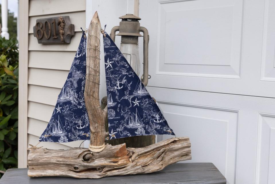 A sailboat made by artist Darren Lee from driftwood he found. Lee owns Beachwood-based D. Lee's Things Adrift, a business featuring his handmade driftwood art.