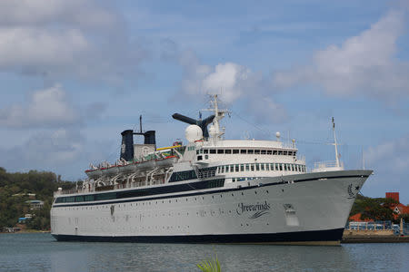 A 440-foot ship owned and operated by the Church of Scientology, SMV Freewinds, is docked under quarantine from a measles outbreak in port near Castries, St. Lucia, May 1, 2019. Picture taken May 1, 2019. REUTERS/Micah George