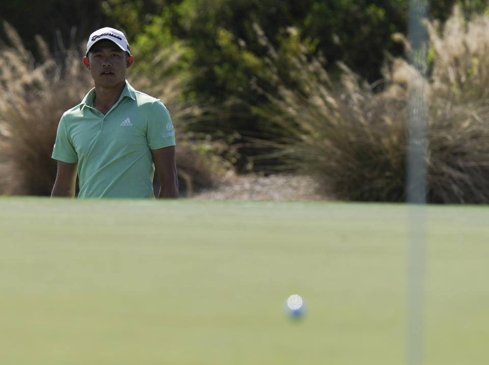 Collin Morikawa of the United States, watches third shot at the third green during the second round of the Hero World Challenge PGA Tour at the Albany Golf Club, in New Providence, Bahamas, Friday, Dec. 3, 2021.(AP Photo/Fernando Llano)