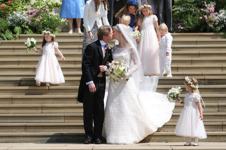 Newlyweds Mr Thomas Kingston and Lady Gabriella Windsor share a kiss on the steps of the chapel after their wedding at St George's Chapel in Windsor Castle, near London, Britain May 18, 2019. Chris Jackson/Pool via REUTERS