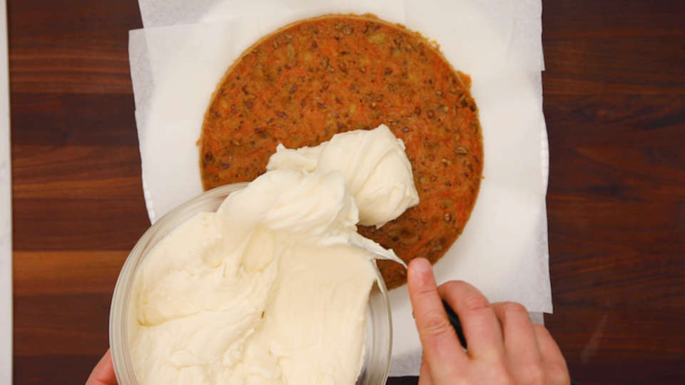 Assembling homemade carrot cake and frosting<p>Parade</p>